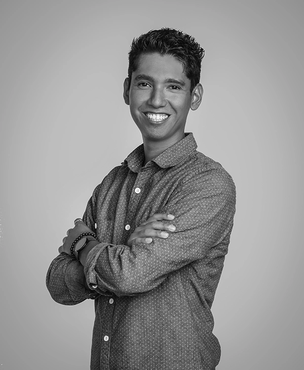 Aaron Flores standing with arms crossed.